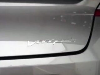 Шильдик Vanquish на новой модели Aston Martin